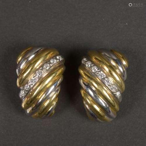 Pair of 18 karat yellow and white gold earrings se…