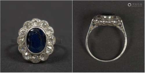 Platinum ring set with a +/ 1.5 carat sapphire and…