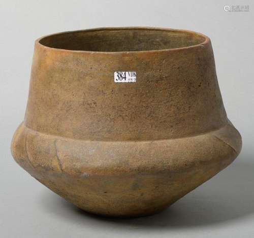 Large terracotta vase with grooved base and striat…