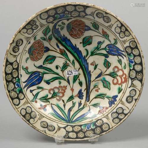 Round Iznik polychrome earthenware dish with flora…