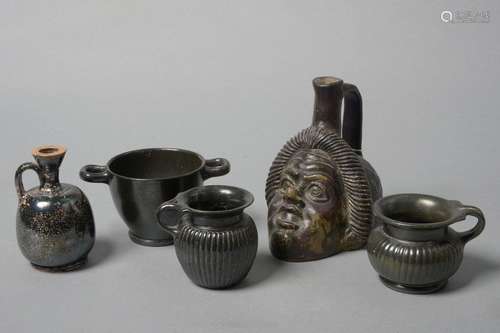 Set of five black glazed terracotta objects includ…