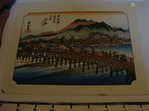 Vintage Japanese Woodblock Print: People traveling over bridge near village