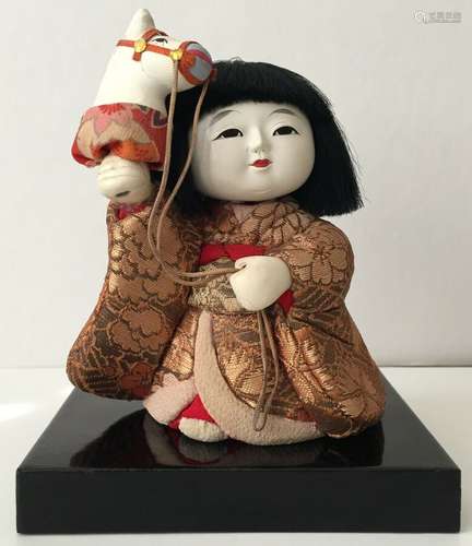 ANTIQUE JAPANESE KIMEKOMI GOSHO DOLL WITH HOLDING A HORSE HEAD.