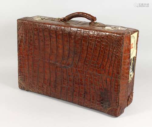 A CROCODILE SUITCASE. 23ins long.