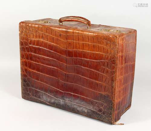 A CROCODILE SUITCASE. 20ins long.