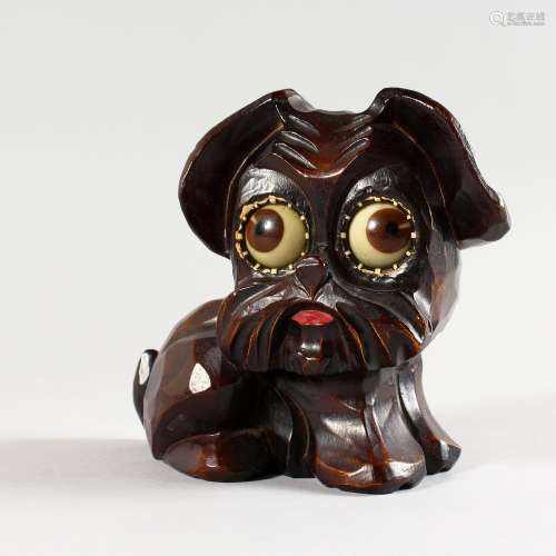 AN AMUSING CARVED WOOD BLACK FOREST CLOCK by OSWALD FREEBURG, of a dog with moving eyes. 4.5ins