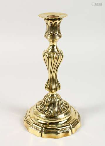 A GOOD BRASS BALUSTER CANDLESTICK. 11ins high.