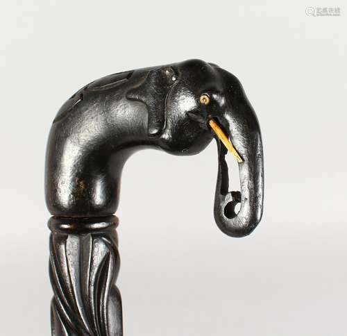 A CEYLONESE ELEPHANT HEAD WALKING STICK. 36ins long.