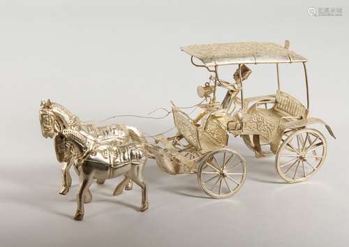 A WHITE METAL MODEL OF A COACH AND HORSES. 9.5ins long.