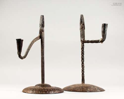 TWO 18TH/19TH CENTURY WROUGHT IRON COMBINATION CANDLESTICKS/RUSH LIGHT HOLDERS, on circular bases.