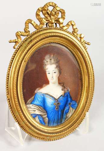 A GOOD 19TH CENTURY OVAL PORTRAIT MINIATURE, of a lady wearing a blue dress, in an ornate ormolu