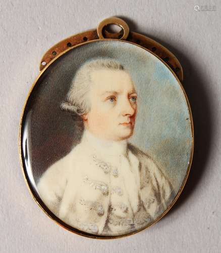 A GEORGIAN OVAL MINIATURE OF A GENTLEMAN, in a gilt metal frame. 1.5cms x 2.5cms.