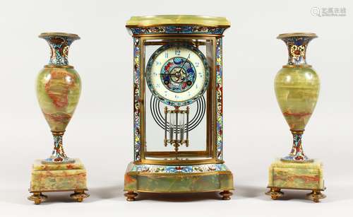 A GOOD FRENCH CHAMPLEVE ENAMEL AND ONYX THREE PIECE CLOCK GARNITURE. Clock: 12ins high. Side Pieces: