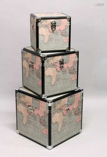 AN UNUSUAL SET OF THREE SQUARE MAP TRUNKS of various sizes.