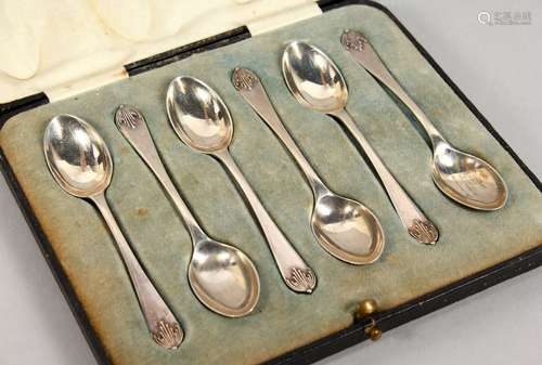 A SET OF SIX SILVER COFFEE SPOONS, cased. Walker & Hall, Sheffield 1934.