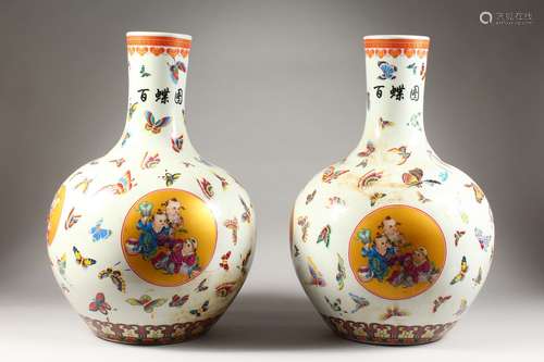 A LARGE PAIR OF CHINESE PORCELAIN BULBOUS VASES, painted with figures and butterflies. 21ins high.