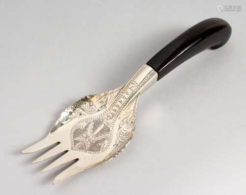 AN EASTERN WHITE METAL FORK, with engraved decoration. 8ins long.