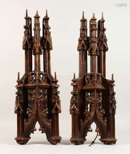 A PAIR OF 19TH CENTURY CARVED WOOD GOTHIC FINIALS. 22ins high.