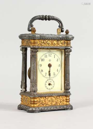 A SMALL CONTINENTAL CARRIAGE CLOCK, with ormolu and cast metal case, porcelain dial striking on a
