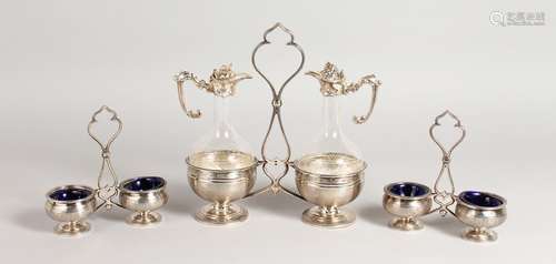 A PAIR OF CONTINENTAL SILVER DOUBLE SALTS, with blue glass liners, and matching vinegar and oil