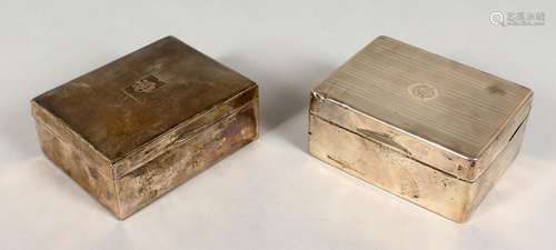 TWO ENGINE TURNED SILVER CIGARETTE BOXES. Both 4.5ins long.