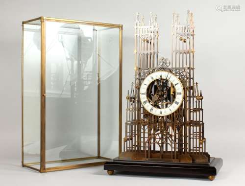 A LARGE BRASS CATHEDRAL SKELETON CLOCK, with fusee movement, in a glass dome on a marble base. 22ins