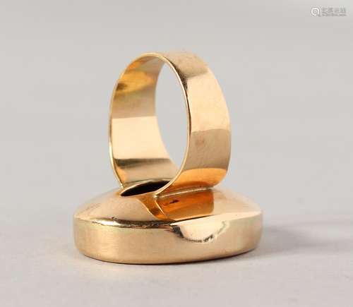 A GEORGIAN GOLD FOB RING, woman with a wheel.