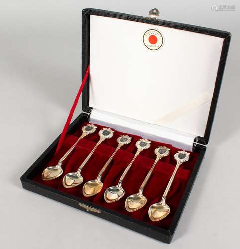 A SET OF SIX TOKYO SILVER SPOONS, cased.