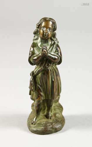 A SMALL CAST BRONZE FIGURE OF A YOUNG GIRL PRAYING. 6ins high.