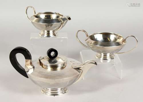 A GOOD ART DECO SILVER CIRCULAR THREE PIECE TEA SET. Sterling. 24ozs.