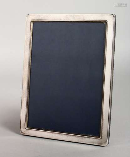 A PLAIN SILVER UPRIGHT PHOTOGRAPH FRAME. 8ins x 6ins.