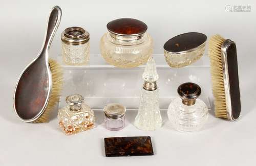 SEVEN SILVER TOP SCENT BOTTLES and TWO BRUSHES.