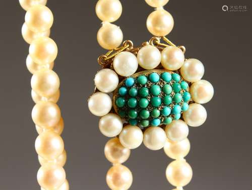 A GOOD TWO-ROW STRING OF PEARLS, with pearl and enamel clasp.