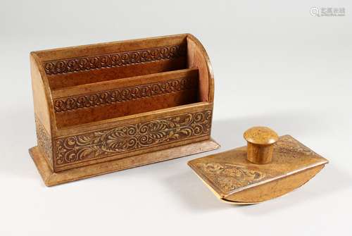 AN EMBOSSED LEATHER STATIONERY RACK, and a similar blotter.