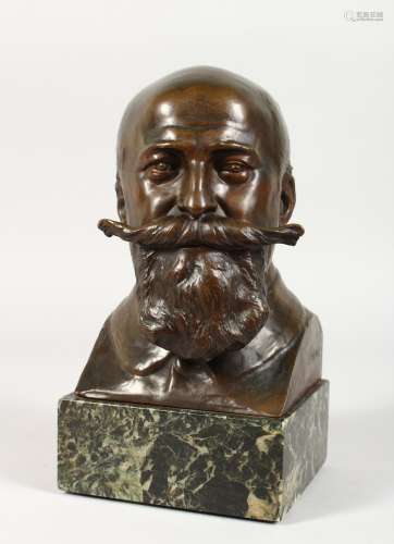 J. RISPAL A BRONZE BUST of a man with handlebar moustache and beard. Signed. 7ins high, on a