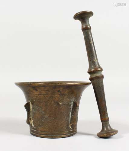 A SMALL CAST BRONZE PESTLE AND MORTAR, with side flanges. 2.75ins high.