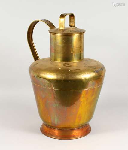 A LARGE BRASS AND COPPER CHURN, with strap handle and lid. 23ins high.