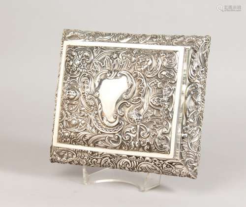 A GOOD RECTANGULAR SILVER BOX, embossed with theatrical masks and flowers. London 1897. Maker: