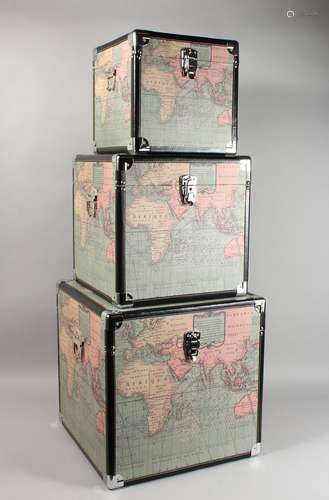 A GRADUATED SET OF STORAGE BOXES, printed with a map of the world.