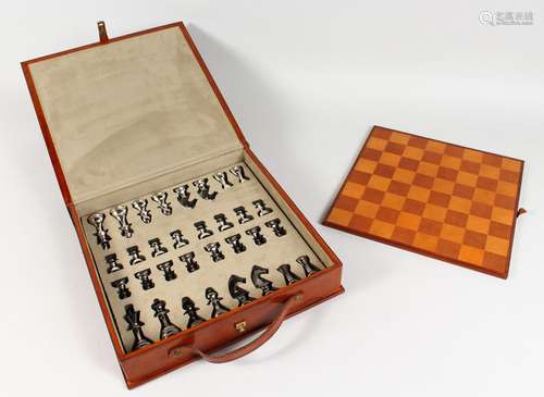 A GOOD LEATHER CASED CHESS SET.