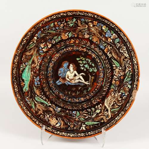 TERRY WILKINS (BOMBAY SCHOOL OF ART). A LARGE CIRCULAR POTTERY CHARGER, enamel decorated with a