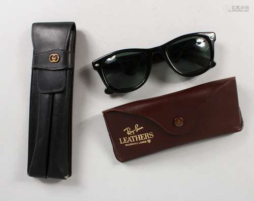 A GUCCI LEATHER CIGAR CASE and A RAY-BAN SUNGLASSES CASE, with sunglasses. Sunglasses are not marked