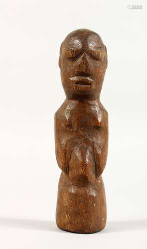 A CARVED OAK EASTER ISLAND FIGURE. 6.5ins high.