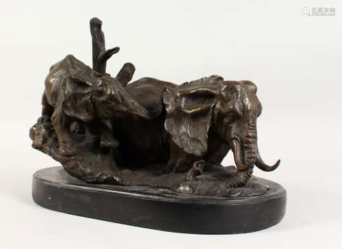 A GOOD BRONZE OF TWO ELEPHANTS, on a marble base. 16ins long.
