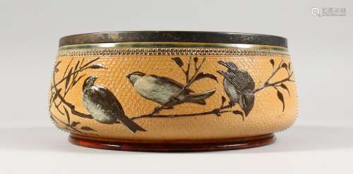 A LARGE DOULTON LAMBETH STONEWARE CIRCULAR FRUIT BOWL painted with birds. Maker F.E.B. No. 930. 1883