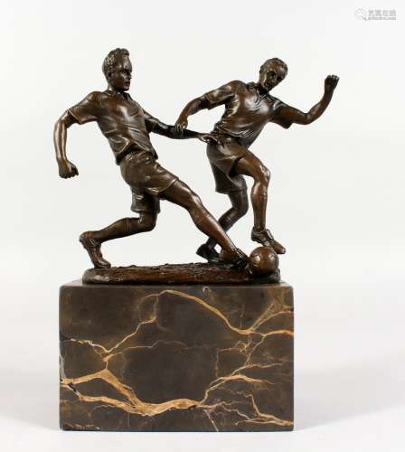 MILO A bronze of two men playing football. Signed, on a marble base. 9ins high overall.