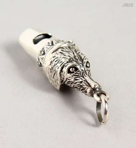 A TINY NOVELTY SILVER DOG'S HEAD WHISTLE.