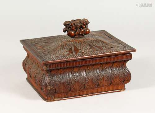 A WOODEN BOX AND COVER, with well carved anthemion leaf decoration. 8.75ins wide.