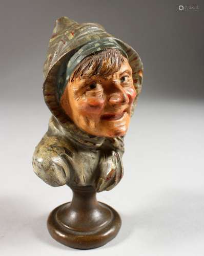 A CONTINENTAL PAINTED TERRACOTTA BUST OF A WOMAN WEARING A HEAD SCARF. 5.5ins high.