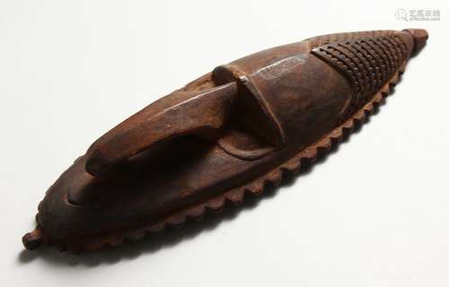 A SMALL NEW GUINEA/SEPIK RIVER CARVED WOOD MASK. 10ins high.